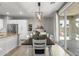 Bright dining room featuring a wooden table, white chairs, and sliding glass doors to the backyard at 21288 E Via Del Sol --, Queen Creek, AZ 85142