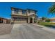 Charming two-story home with a neutral palette, a spacious driveway, and a well-maintained front yard at 21288 E Via Del Sol --, Queen Creek, AZ 85142