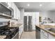 Well-equipped kitchen with stainless steel appliances, granite countertops, and ample white cabinetry at 21288 E Via Del Sol --, Queen Creek, AZ 85142