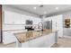 Bright kitchen featuring granite countertops, a subway tile backsplash, and stainless steel appliances at 21288 E Via Del Sol --, Queen Creek, AZ 85142