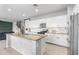 Spacious kitchen featuring a granite island, stainless steel appliances, and white cabinets at 21288 E Via Del Sol --, Queen Creek, AZ 85142