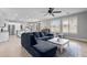 Comfortable living room with a large sectional sofa, open to the kitchen and dining areas at 21288 E Via Del Sol --, Queen Creek, AZ 85142