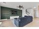 Stylish living room with an accent wall, floating shelves, and comfortable seating at 21288 E Via Del Sol --, Queen Creek, AZ 85142