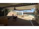 Outdoor living space: covered patio overlooking a sparkling pool and desert landscape at 2137 W Del Campo Cir, Mesa, AZ 85202