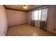 Bedroom featuring neutral tile flooring, pink walls, and a ceiling fan with lights at 2137 W Del Campo Cir, Mesa, AZ 85202