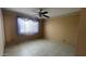 Bedroom featuring tiled floors, a ceiling fan and a large window for great natural light at 2137 W Del Campo Cir, Mesa, AZ 85202