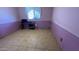 Bedroom with light purple walls, tile flooring, and a desk by the window at 2137 W Del Campo Cir, Mesa, AZ 85202