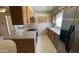Another view of the kitchen, featuring stainless steel appliances and neutral countertops at 2137 W Del Campo Cir, Mesa, AZ 85202