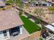Aerial view of the house showcasing a well-maintained yard, outdoor kitchen and patio area at 21595 S 225Th Way, Queen Creek, AZ 85142