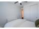 Clean bedroom featuring neutral decor, a ceiling fan, and a large closet, providing ample storage at 21595 S 225Th Way, Queen Creek, AZ 85142