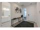 Stylish entryway showcasing tiled floors, modern decor, and an open view into the home's interior at 21595 S 225Th Way, Queen Creek, AZ 85142