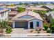 Home with desert-friendly landscaping, an attached two-car garage, and a welcoming facade at 21595 S 225Th Way, Queen Creek, AZ 85142