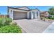 Beautiful home featuring desert landscaping, a two-car garage, and a covered entryway at 21595 S 225Th Way, Queen Creek, AZ 85142