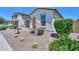Lovely one-story home featuring desert landscaping, a two-car garage, and well-manicured shrubbery at 21595 S 225Th Way, Queen Creek, AZ 85142