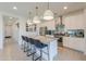 Stylish kitchen featuring white cabinetry, stainless steel appliances, and a center island at 21595 S 225Th Way, Queen Creek, AZ 85142