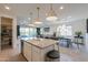 Kitchen with stainless steel appliances, granite countertops, and view of the dining and living rooms at 21595 S 225Th Way, Queen Creek, AZ 85142