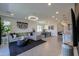 Spacious open-concept living room, dining room and kitchen with contemporary furnishings at 21595 S 225Th Way, Queen Creek, AZ 85142
