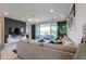 Comfortable living room with sliding glass doors to patio, and modern decor at 21595 S 225Th Way, Queen Creek, AZ 85142