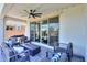 Covered outdoor patio with a ceiling fan, patio furniture and view of the backyard at 21595 S 225Th Way, Queen Creek, AZ 85142