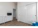 Bedroom features tile floors, neutral walls, large closet, and window with blinds at 21950 N Dietz Dr, Maricopa, AZ 85138