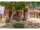 Charming single-Gathering home featuring desert landscaping, covered porch, and a two-car garage at 21950 N Dietz Dr, Maricopa, AZ 85138