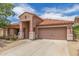 Charming single-Gathering home featuring desert landscaping, covered porch, and a two-car garage at 21950 N Dietz Dr, Maricopa, AZ 85138