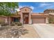 Charming single-Gathering home featuring desert landscaping, covered porch, and a two-car garage at 21950 N Dietz Dr, Maricopa, AZ 85138