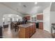 Spacious kitchen features a large island, dining area, stainless steel appliances, and ample cabinet space at 21950 N Dietz Dr, Maricopa, AZ 85138