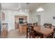 Eat-in kitchen features a center island, wooden cabinets, stainless steel refrigerator and ample cabinet space at 21950 N Dietz Dr, Maricopa, AZ 85138