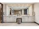 This bathroom features a double vanity, walk-in shower, and neutral color scheme at 2211 E Camelback Rd # 1203, Phoenix, AZ 85016