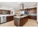 Gourmet kitchen featuring a center island, stainless steel appliances, and custom cabinetry at 2211 E Camelback Rd # 1203, Phoenix, AZ 85016