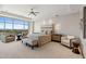 Spacious main bedroom featuring floor-to-ceiling windows with stunning city views at 2211 E Camelback Rd # 1203, Phoenix, AZ 85016