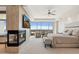 Large main bedroom with a fireplace, television, and floor-to-ceiling windows at 2211 E Camelback Rd # 1203, Phoenix, AZ 85016