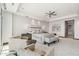 Bright and airy main bedroom with a ceiling fan and stylish pendant lighting at 2211 E Camelback Rd # 1203, Phoenix, AZ 85016