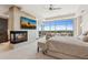 Stunning main bedroom with fireplace, city view, and access to outdoor balcony at 2211 E Camelback Rd # 1203, Phoenix, AZ 85016