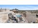 Rooftop pool area with mountain view, lounge chairs, umbrellas and dining areas at 2211 E Camelback Rd # 1203, Phoenix, AZ 85016