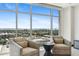 Inviting sitting area with comfortable armchairs and panoramic city views at 2211 E Camelback Rd # 1203, Phoenix, AZ 85016