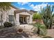 Charming back patio with lush desert landscaping and convenient access to the home at 22231 N 51St St, Phoenix, AZ 85054