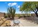 Inviting back patio boasting desert landscaping and views of the golf course at 22231 N 51St St, Phoenix, AZ 85054