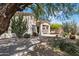 Beautiful home exterior featuring a desert landscaped yard and a shaded patio at 22231 N 51St St, Phoenix, AZ 85054