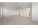 Expansive bedroom offers carpet, ceiling fan and access to the ensuite bathroom at 22231 N 51St St, Phoenix, AZ 85054