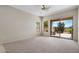 Spacious bedroom boasting carpet, large sliding glass door and windows showing views of the outdoors at 22231 N 51St St, Phoenix, AZ 85054