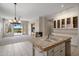 Open-concept kitchen and living room with views to the backyard and stainless steel appliances at 22231 N 51St St, Phoenix, AZ 85054