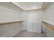 Well-organized walk-in closet with custom shelves, clothing rods, and built-in drawers at 22231 N 51St St, Phoenix, AZ 85054