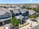 Aerial view of the house showing the unique blue exterior paint, and desert landscaping at 23451 S 228Th St, Queen Creek, AZ 85142
