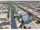 Aerial view of homes in a suburban neighborhood, featuring parks, streets, and mature trees at 23451 S 228Th St, Queen Creek, AZ 85142
