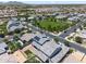 Aerial view of homes in a suburban neighborhood with a community park and putting green at 223451 S 228Th St, Queen Creek, AZ 85142
