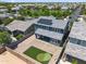 Aerial view of backyard showcasing a putting green, brick pavers, and an outdoor covered patio at 23451 S 228Th St, Queen Creek, AZ 85142