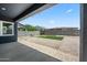 Backyard featuring a putting green, gravel, paved area and block fence at 23451 S 228Th St, Queen Creek, AZ 85142
