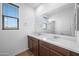 Bathroom with double sink vanity, granite counters, and large mirror at 223451 S 228Th St, Queen Creek, AZ 85142